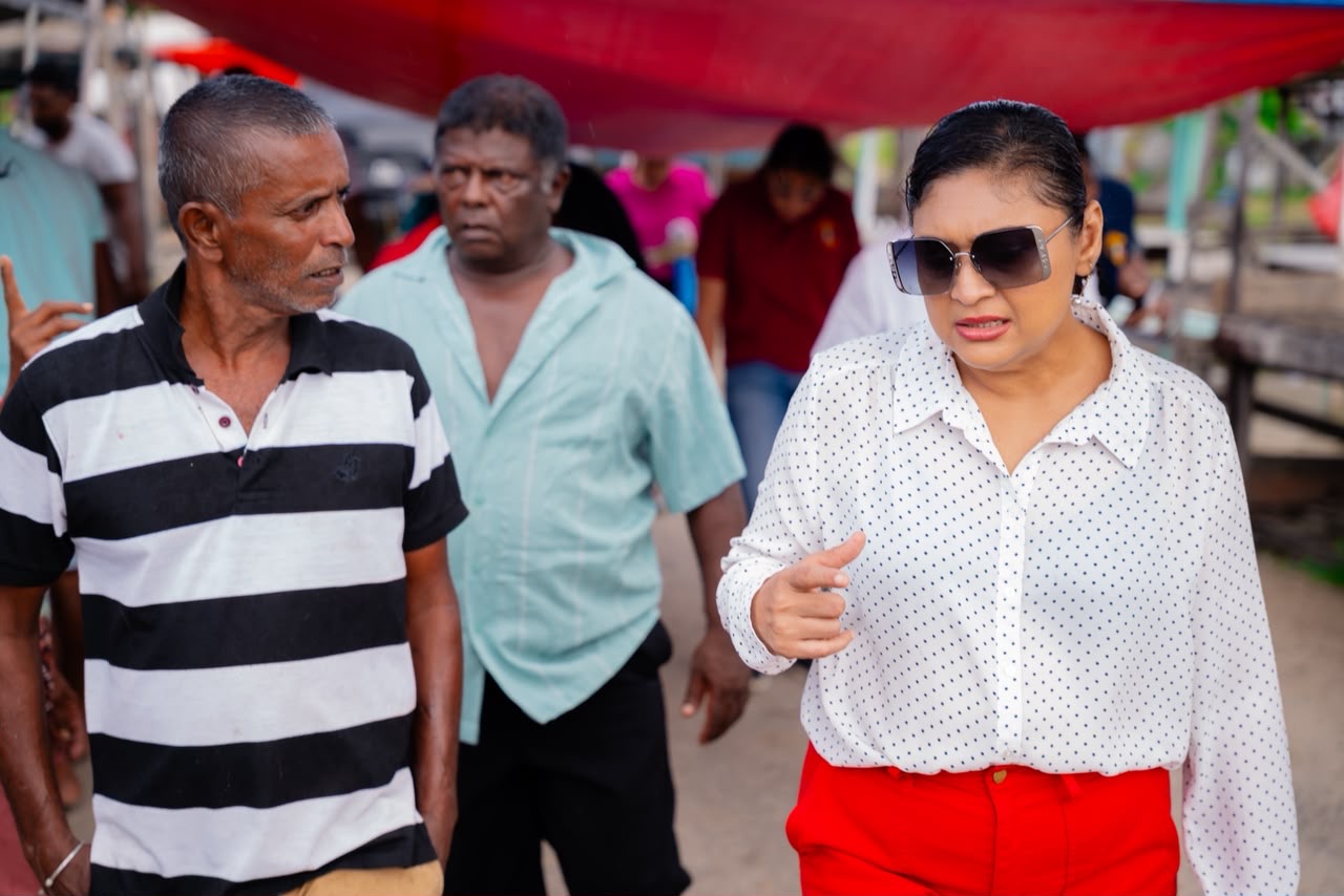 Minister Manickchand visits Bath Market, updates vendors on completion.